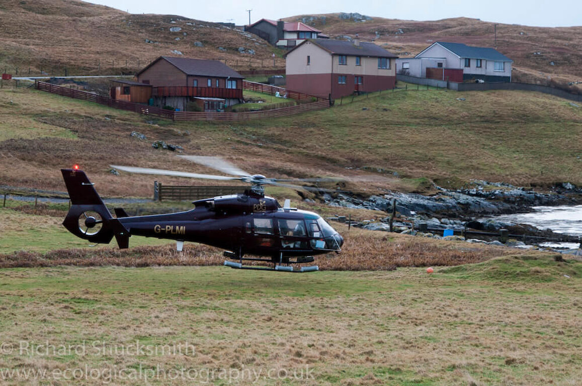 Chopper taking off with Lindsay and the field team just in front of the house.